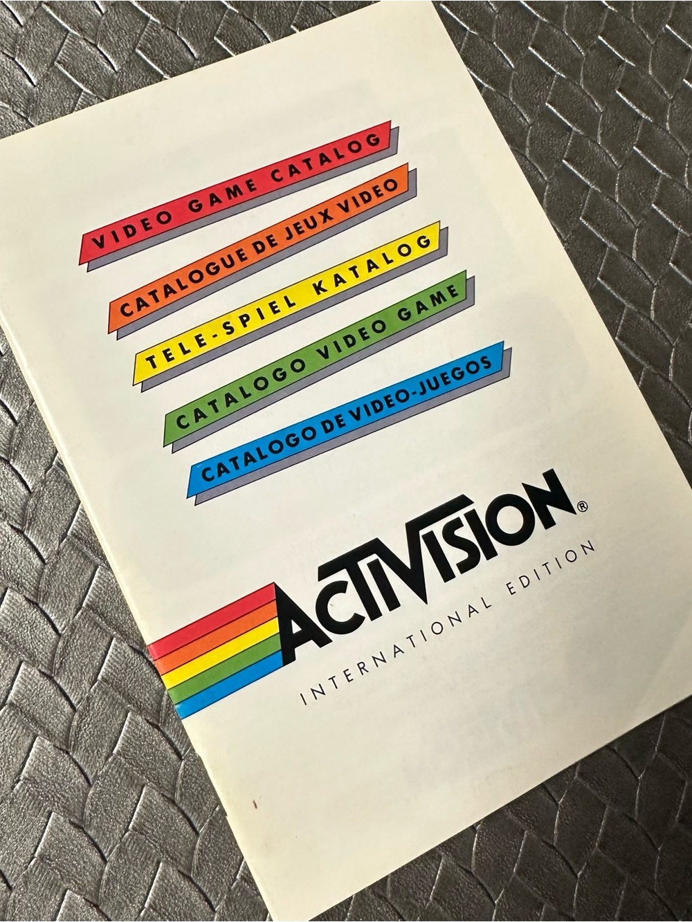 Activision International Edition Video Game Catalog - White with Rainbow Accents